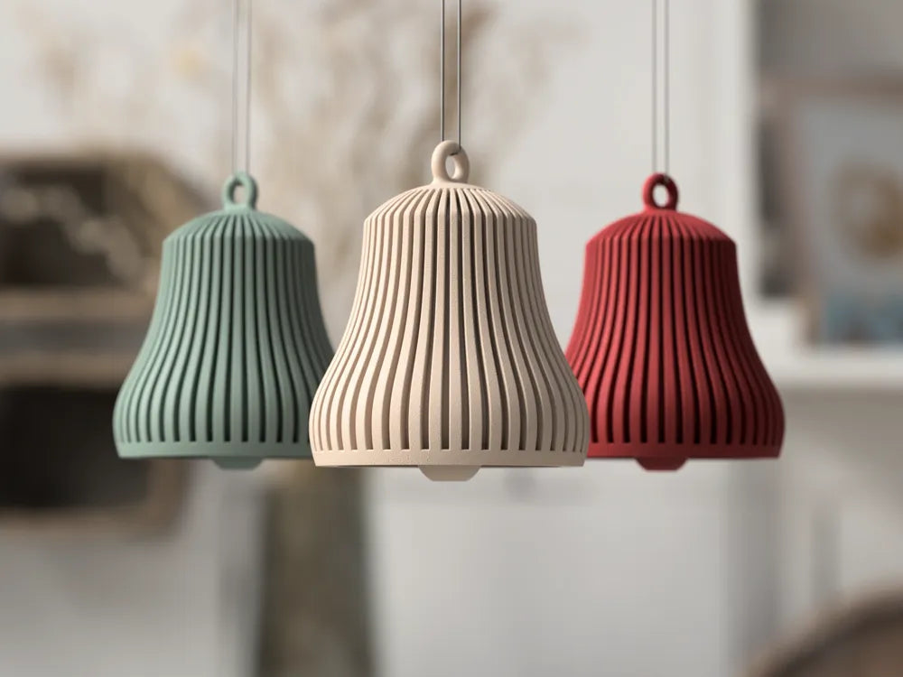 Sage Green, Neutral Beige, and Burgundy ribbed Christmas bell ornaments hanging in a holiday room
