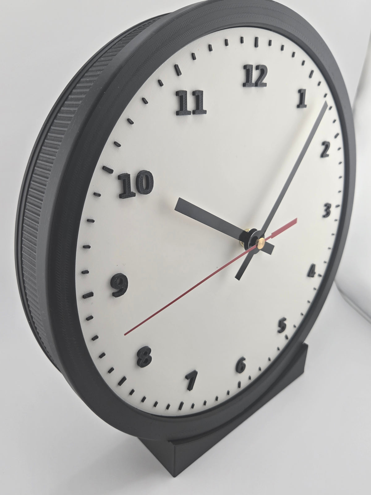 Angled physical view showing the Tight Rib side of the Standard Arabic illuminated modular clock