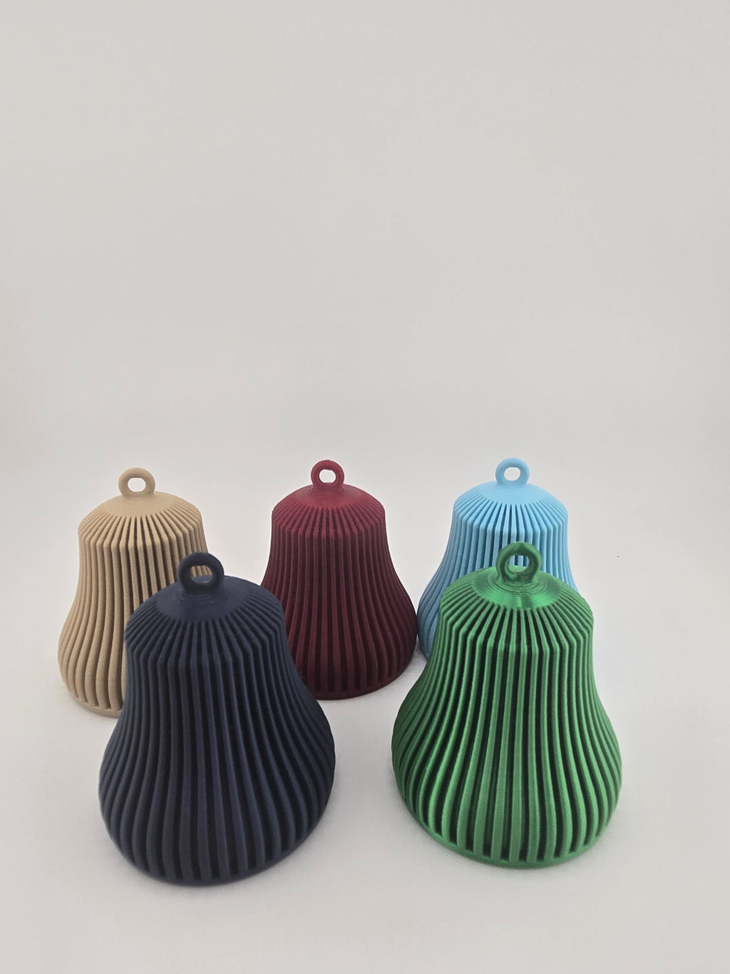 Functional ribbed Christmas bell ornaments in Neutral Beige, Burgundy, Light Blue, Black, and Sage Green