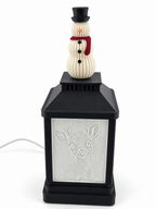 Christmas snowman topper pack installed on an unlit lantern; lantern sold separately