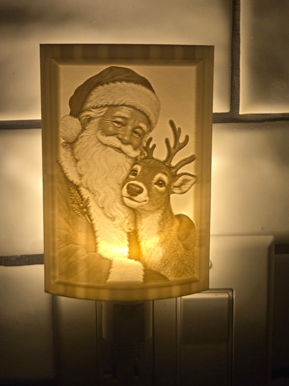 Santa lithophane motion-sensor night light featuring Santa Claus and a reindeer