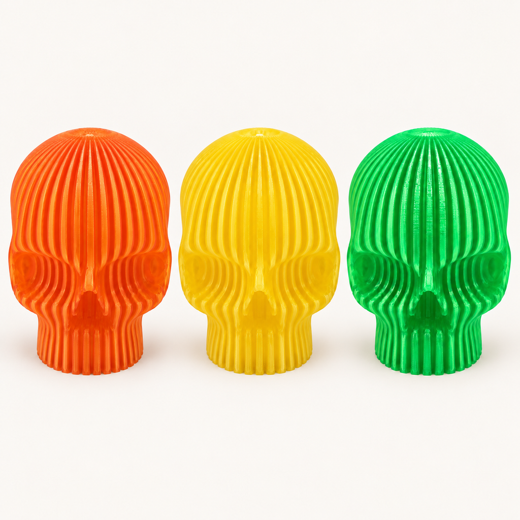 All three Modern Skull LED Tealight Holders: orange, yellow and green